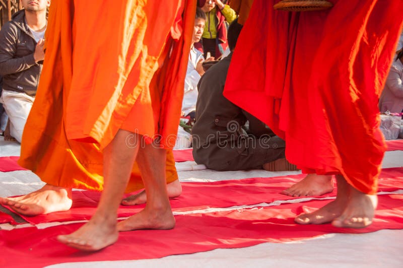 More monks with give alms bowl which came out of the offerings in the morning at Buddhist temple, Culture Heritage Site. More monks with hand holding give alms stock photos More monks with give alms bowl which came out of the offerings in the morning at Buddhist temple, Culture Heritage Site. More monks with hand holding give alms stock photos