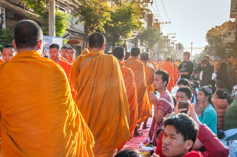 More monks with give alms bowl which came out of the offerings in the morning at Buddhist temple, Culture Heritage Site. More monks with hand holding give alms stock photography More monks with give alms bowl which came out of the offerings in the morning at Buddhist temple, Culture Heritage Site. More monks with hand holding give alms stock photography