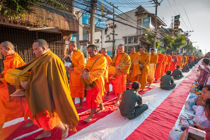 More monks with give alms bowl which came out of the offerings in the morning at Buddhist temple, Culture Heritage Site. More monks with hand holding give alms stock image More monks with give alms bowl which came out of the offerings in the morning at Buddhist temple, Culture Heritage Site. More monks with hand holding give alms stock image