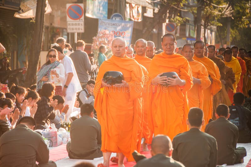 More monks with give alms bowl which came out of the offerings in the morning at Buddhist temple, Culture Heritage Site. More monks with hand holding give alms stock photo More monks with give alms bowl which came out of the offerings in the morning at Buddhist temple, Culture Heritage Site. More monks with hand holding give alms stock photo
