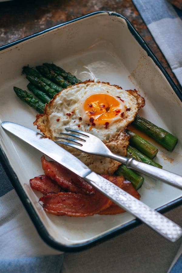 Morning Breakfast, Fried Eggs, Asparagus, Bacon and Avocado in a Stock