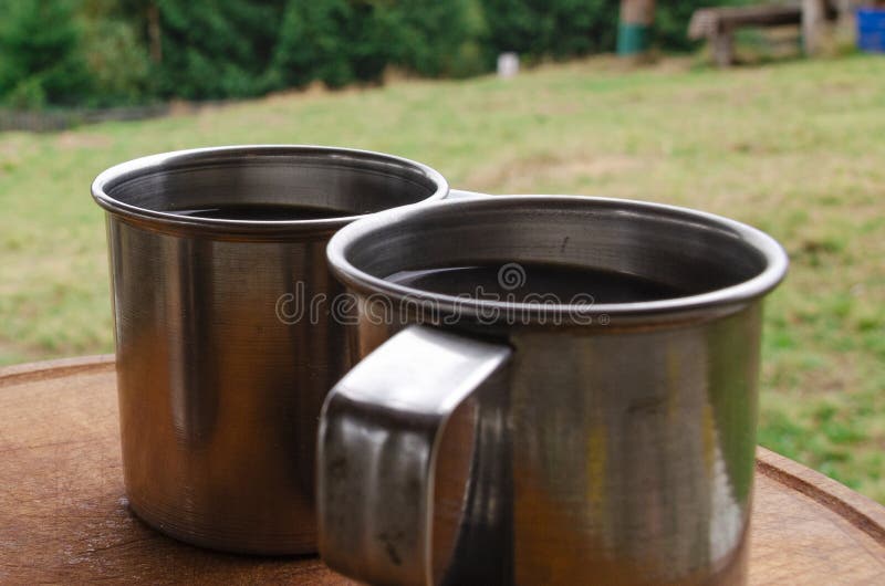 Morning Coffee in Metal Cups at an Alpine Camping Stock Photo Image