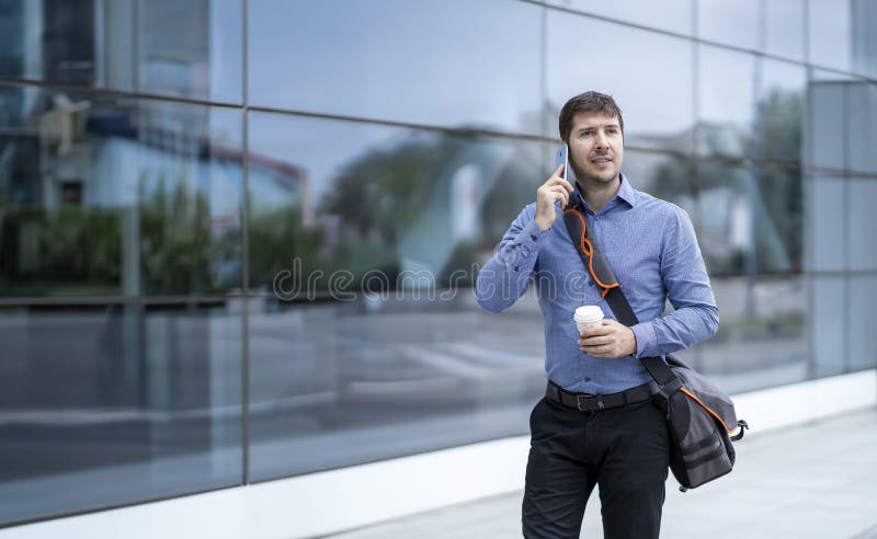 Morning Commute: Modern Young Professional Embracing Productivity in Urban Business Setting stock photo Morning Commute: Modern Young Professional Embracing Productivity in Urban Business Setting stock photo