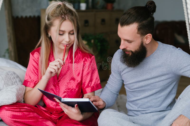 Morning coziness young couple pyjamas make plans