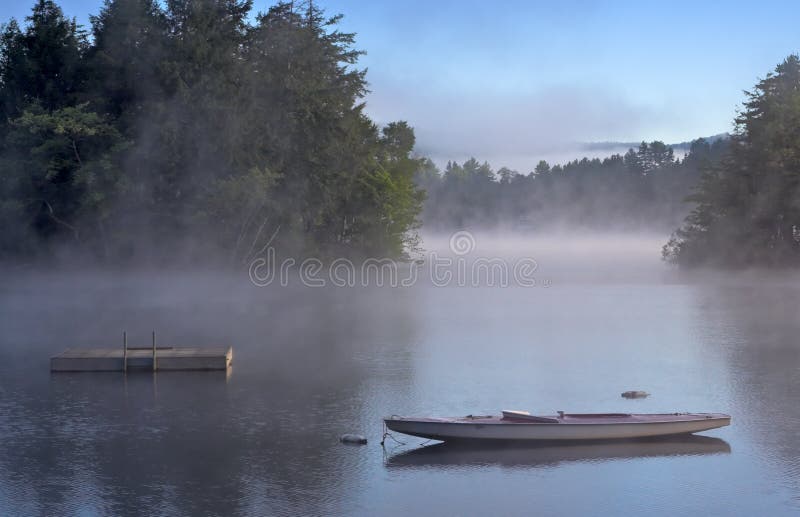 Morning Fog on a Lake royalty free stock image