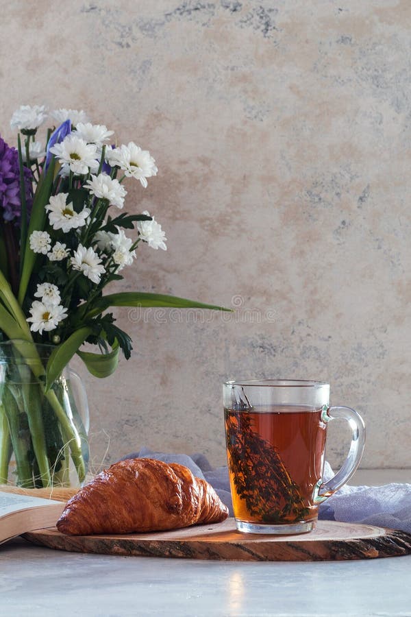 Morning Herbal Tea Cup and Summer Flowers Near Window View on Blue