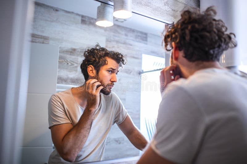 Morning Hygiene, Handsome Man in the Bathroom Looking in Mirror ...