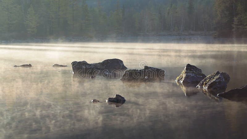 Morning lake and fog after sunrise