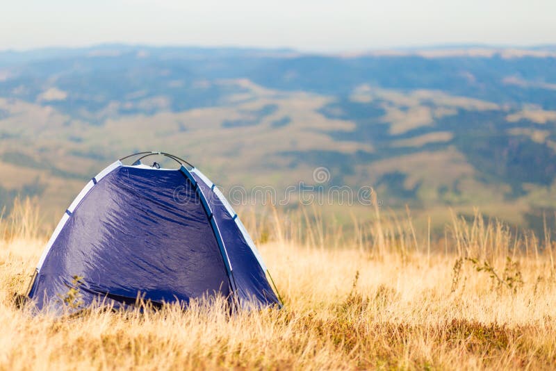 Morning Landscape in Mountains with Blue Tent. Camping Vacation Concept ...