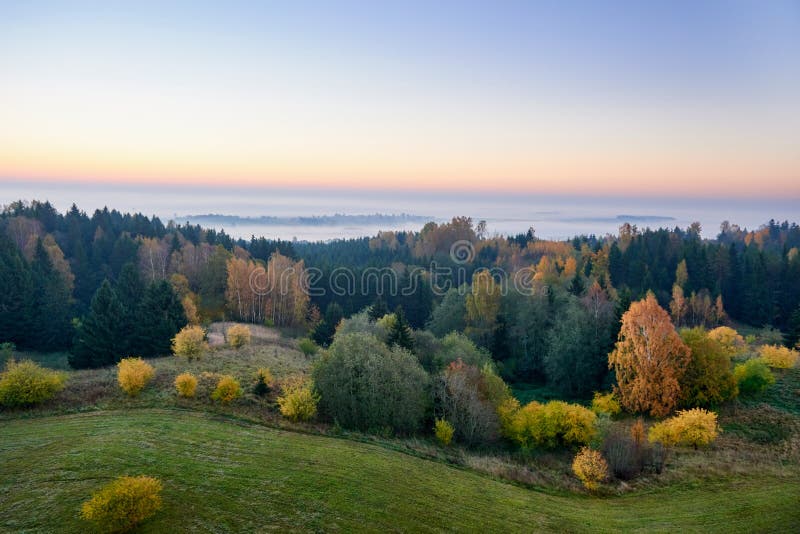 Morning landspace with sun rays. Beautiful landscape with forest and fog.Lithuanian landscape stock photos Morning landspace with sun rays. Beautiful landscape with forest and fog.Lithuanian landscape stock photos