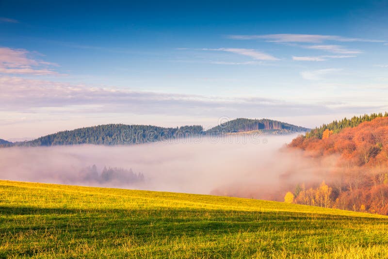 Morning mist defiling the valley.