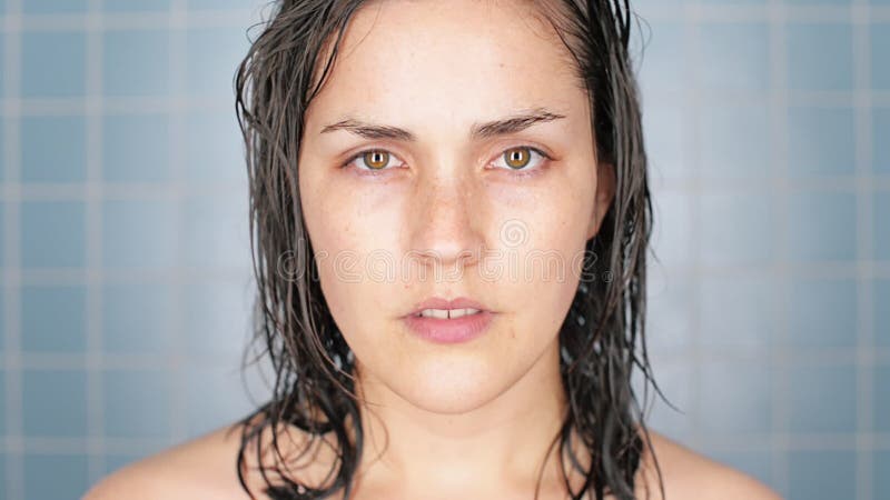 The morning ritual is so important. 4k video footage of a young woman completing her morning hygiene routine. stock footage