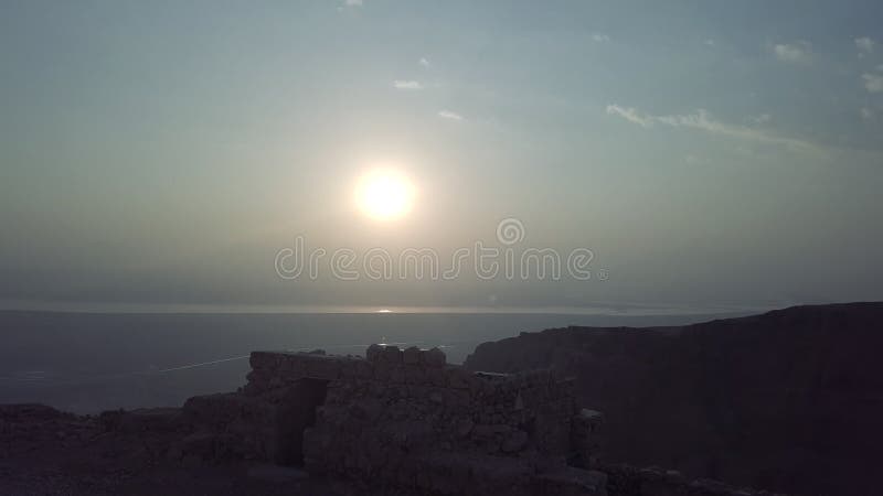 Morning sun in israel desert, remains of masada fortress