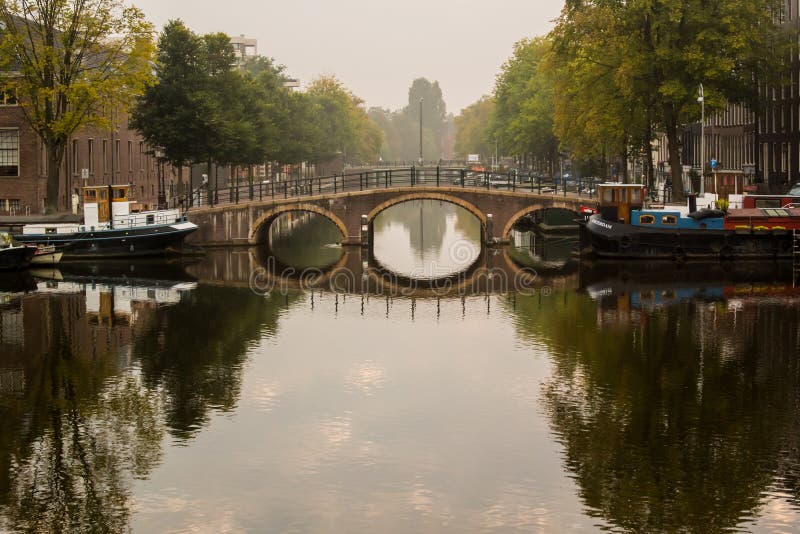 Morning view of canal bridge in Amsterdam stock image Morning view of canal bridge in Amsterdam stock image