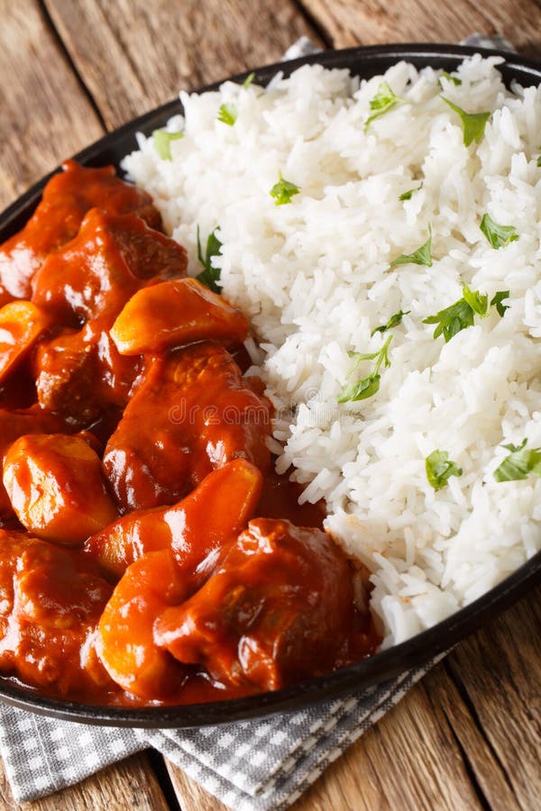 Moroccan Beef Stew with Apples in Tomato Sauce Served with Rice Closeup