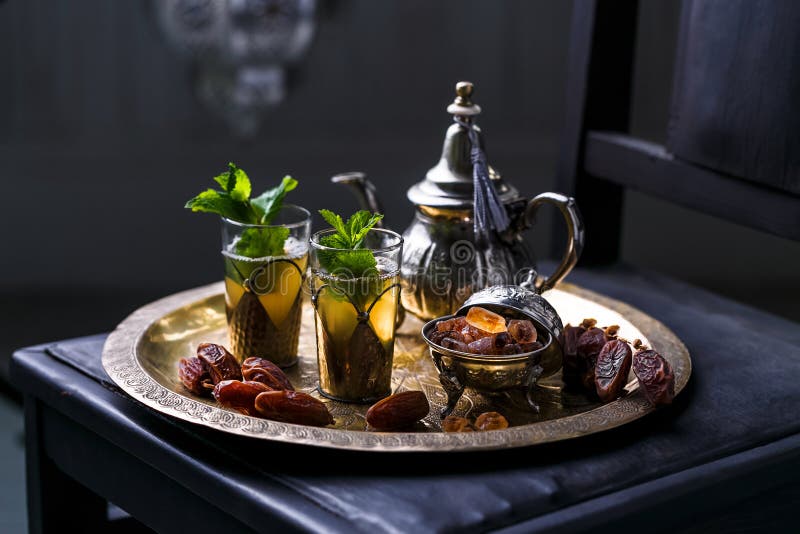 Moroccan Mint Tea in the Traditional Glasses on a Tray and Kettle Stock