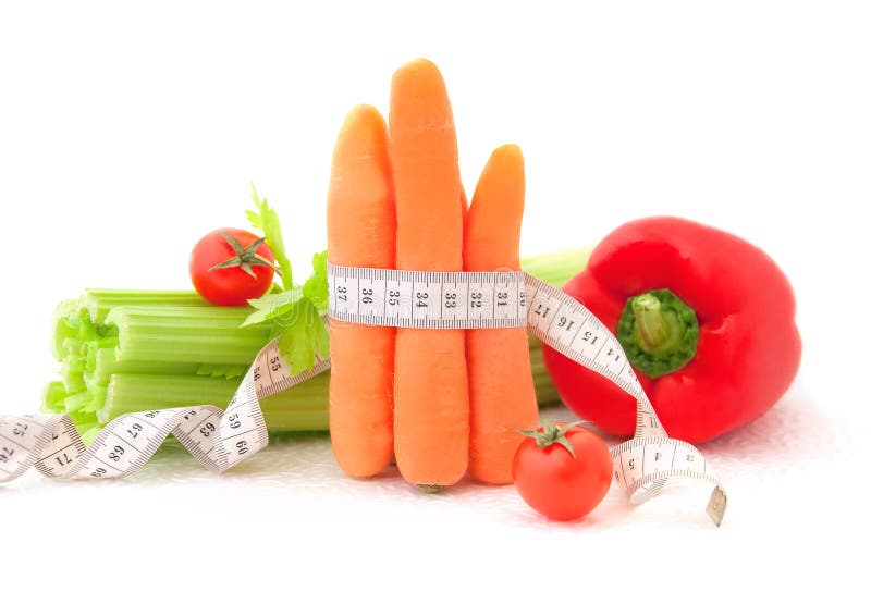 Carrots with tape measure and vegetables on the white background, concept of diet. Carrots with tape measure and vegetables on the white background, concept of diet