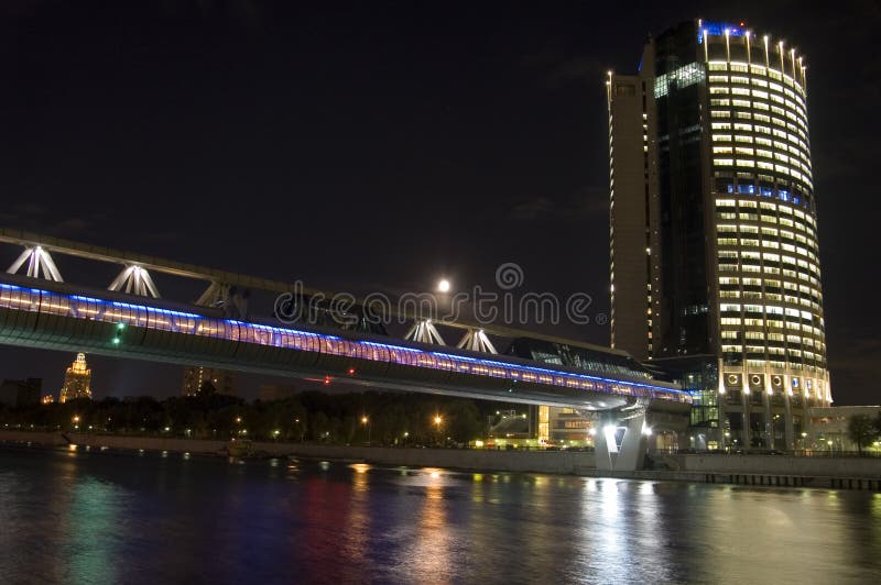 Moscow business center and bridge over river, night scene