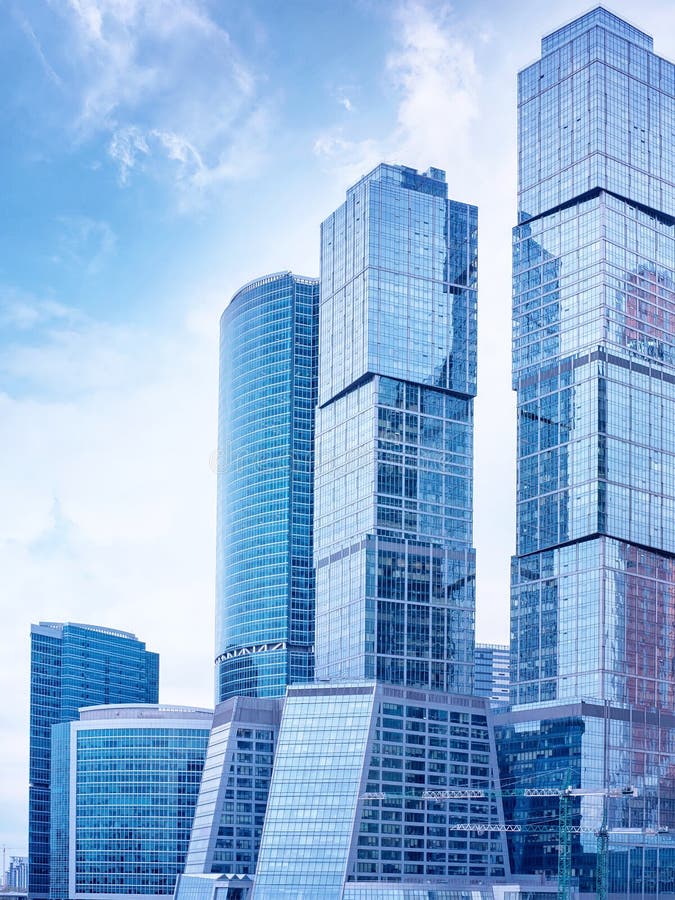 Moscow International Business Center Moscow City. Moscow, Russia. Blue toned downtown skyscrapers against cloudy sky. Moscow International Business Center Moscow City. Moscow, Russia. Blue toned downtown skyscrapers against cloudy sky