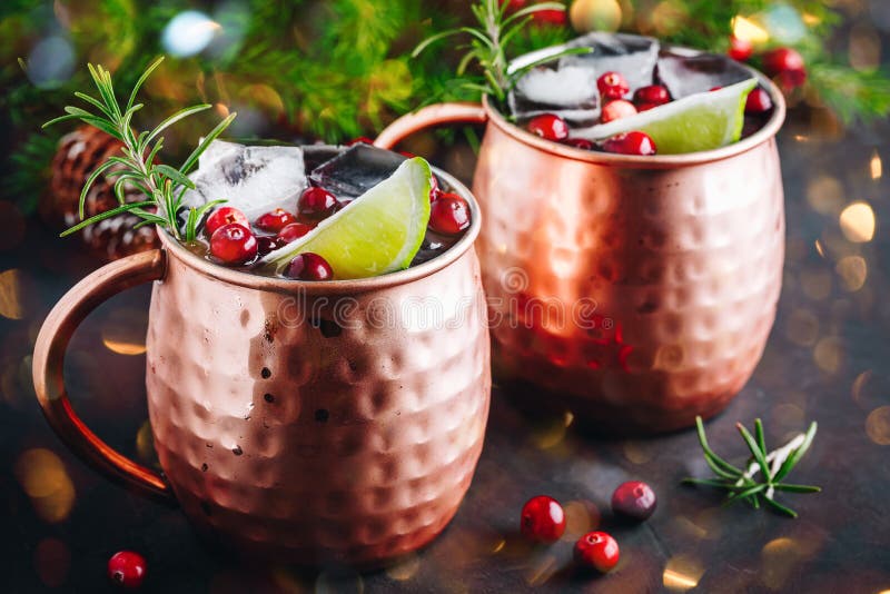 Moscow Mule Cocktail with Cranberries in Copper Mugs for Christmas