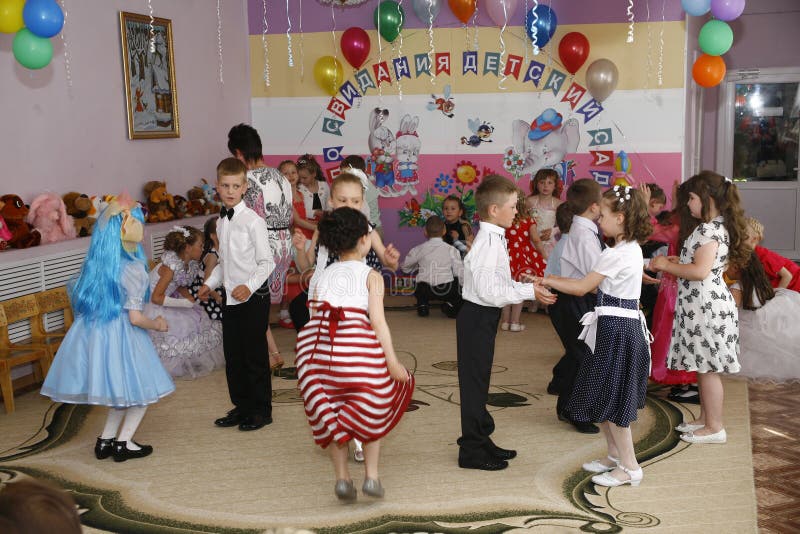 Moscow, Russia-April 17, 2014:children dancing and playing during a party in kindergarte stock images Moscow, Russia-April 17, 2014:children dancing and playing during a party in kindergarte stock images