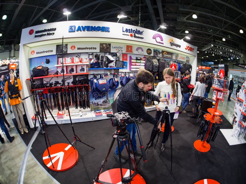 MOSCOW, RUSSIA - APRIL 11, 2019: Common booth of Manfrotto, Avenger, Lastolite, Colorama, Lowepro and Joby companies at PhotoForum 2019 trade show and exhibition in Moscow, Russia on April 11, 2019