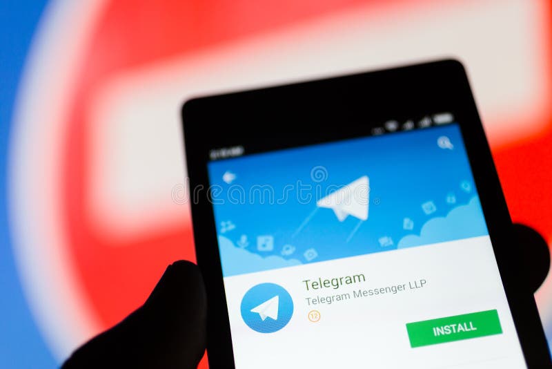 MOSCOW, RUSSIA - APRIL 17, 2018: A mobile phone in the hand with the Telegram application on the Google Play store