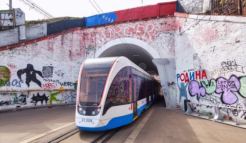 Tramway tunnel with public graffiti on stone wall in center of Moscow