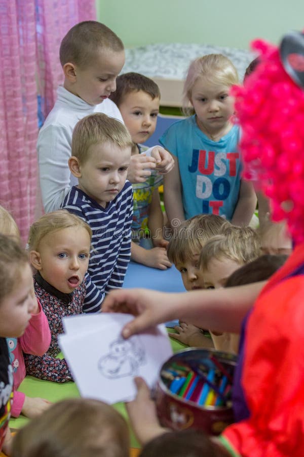 2019.01.22, Moscow, Russia. Children drawing around the table in the kid`s garden. royalty free stock photos 2019.01.22, Moscow, Russia. Children drawing around the table in the kid`s garden. royalty free stock photos