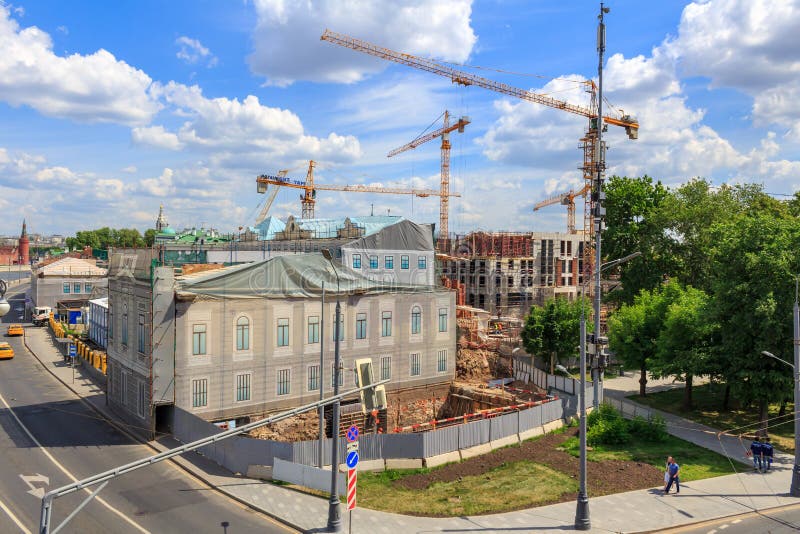 Moscow, Russia - June 03, 2018: High-rise cranes at the construction site in center of Moscow on a blue sky background stock photos Moscow, Russia - June 03, 2018: High-rise cranes at the construction site in center of Moscow on a blue sky background stock photos