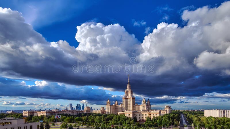 Aerial panoramic view of sunset  campus buildings of famous Moscow university under dramatic cloudy sky in spring