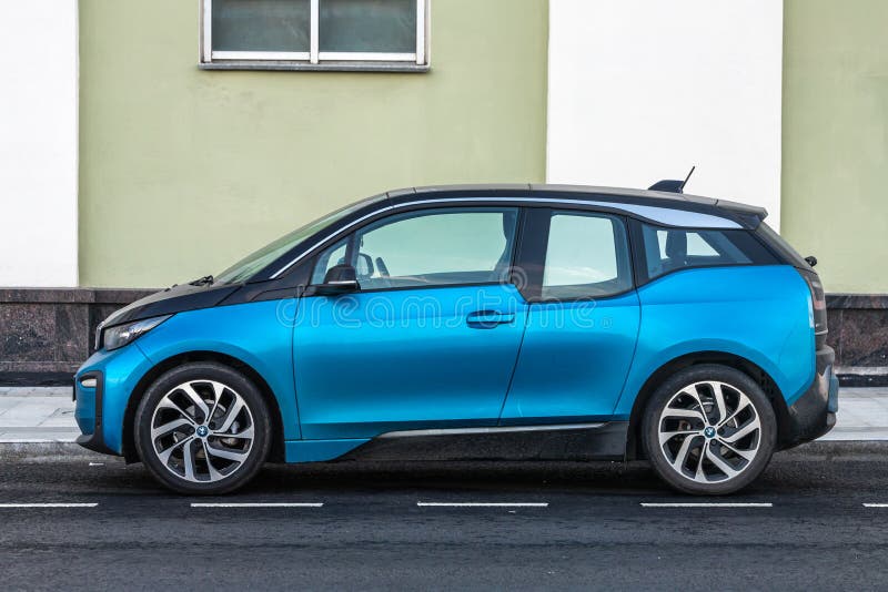 Moscow; Russia - October 15; 2021: blue BMW i3 is parked on the street on a warm autumn day against the backdrop of a street