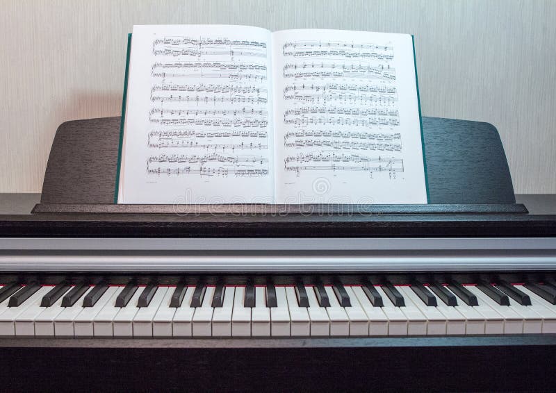 An Open Book of Sheet Music on the Piano. a Composition of the Sheet