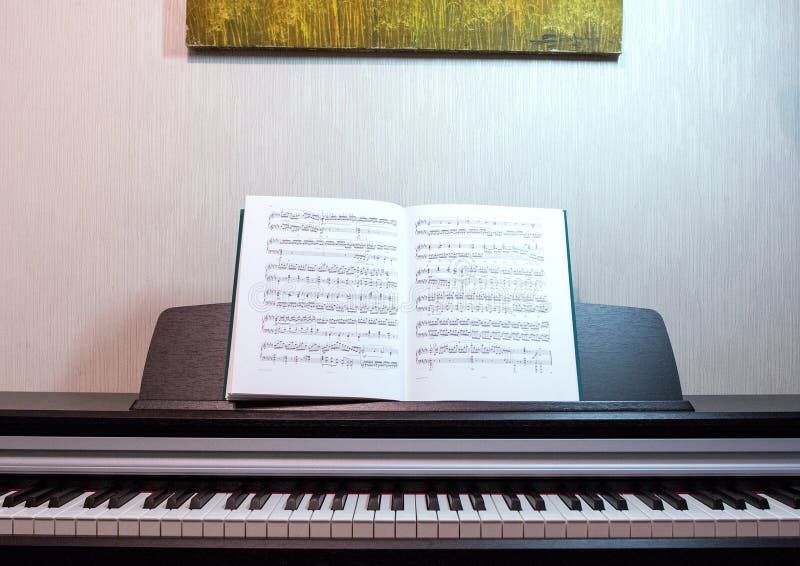 An Open Book of Sheet Music on the Piano. a Composition of the Sheet