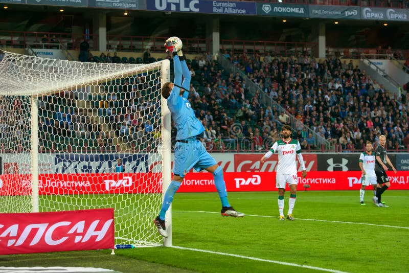 Goalkeeper in a jump catches the ball royalty free stock image Goalkeeper in a jump catches the ball royalty free stock image