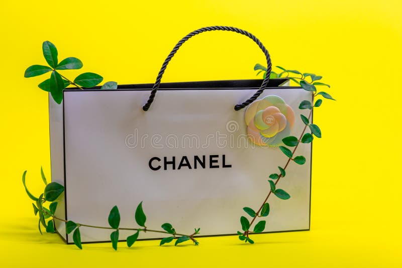 White Chanel Bag and Climbing Plant on Yellow Background
