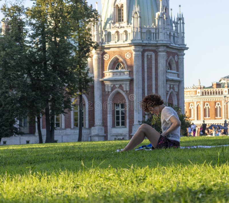 Moscow, Russia - 08.07.2023 - Young woman enjoying day out at Tsaritsyno Museum-Reserve. Outdoor