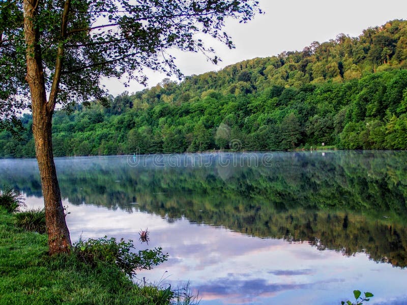 Moselle River Reflecting Trees of Water Sunset near Toul France Campground royalty free stock photo Moselle River Reflecting Trees of Water Sunset near Toul France Campground royalty free stock photo