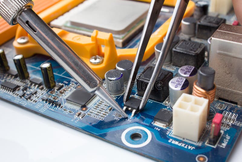 A MOSFET Transistor Key is Soldered Out of Computer Board Using a Soldering  Iron and Tweezers Stock Photo - Image of processor, unit: 200807148