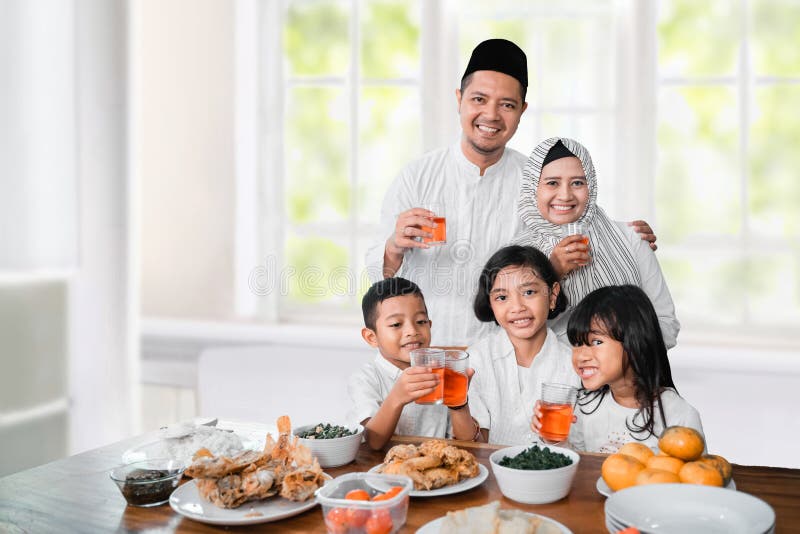 Muslim family break fasting together at home. Muslim family break fasting together at home