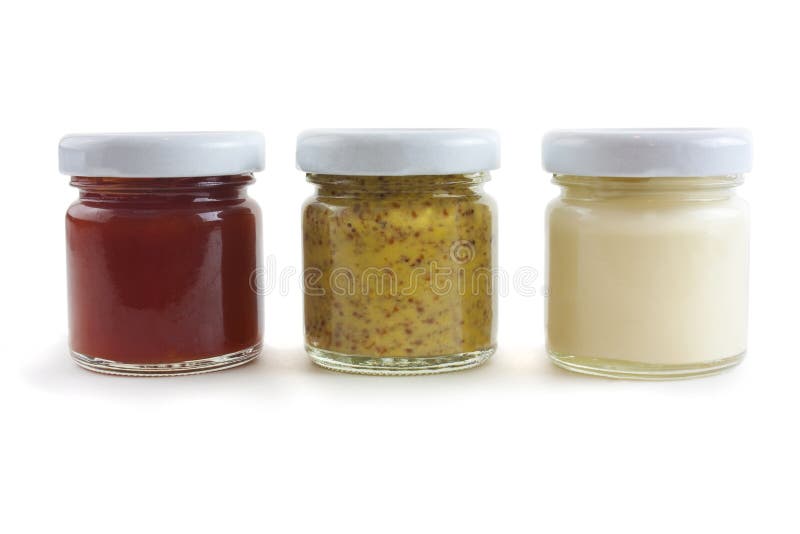 Jars of sauces including mustard, mayo and tomato sauce. Jars of sauces including mustard, mayo and tomato sauce