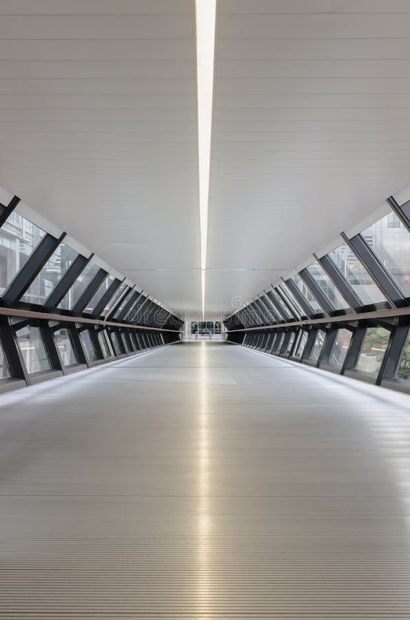 Modern tunnel of one canada square bridge in Canary Wharf. Modern tunnel of one canada square bridge in Canary Wharf