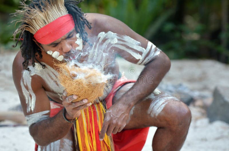 Portrait of one Yugambeh Aboriginal warrior demonstrate fire making craft during Aboriginal culture show in Queensland, Australia. Portrait of one Yugambeh Aboriginal warrior demonstrate fire making craft during Aboriginal culture show in Queensland, Australia.