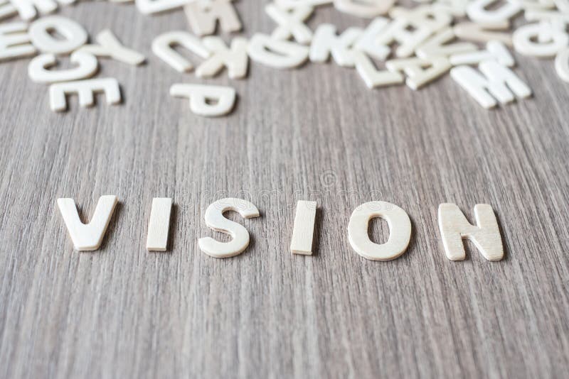 Mot de VISION des lettres en bois d'alphabet Affaires et idée image stock Mot de VISION des lettres en bois d'alphabet Affaires et idée image stock
