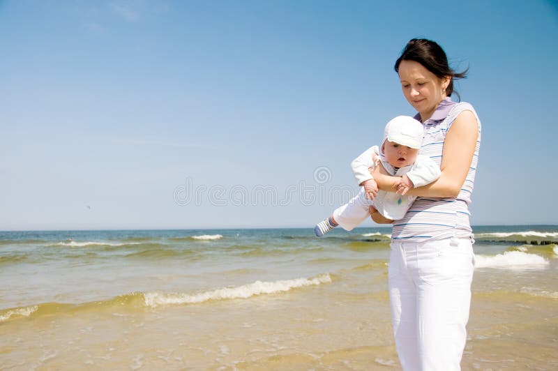 Mother with baby at the beach