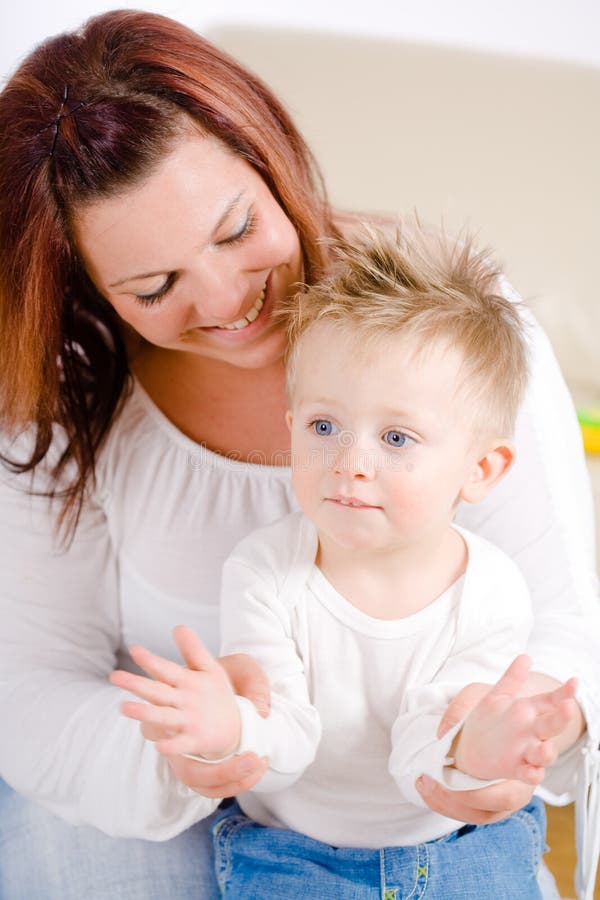 Mother and baby clapping royalty free stock image Mother and baby clapping royalty free stock image