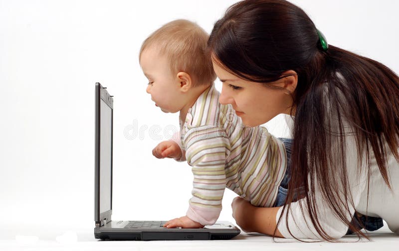 Mother and baby girl with laptop