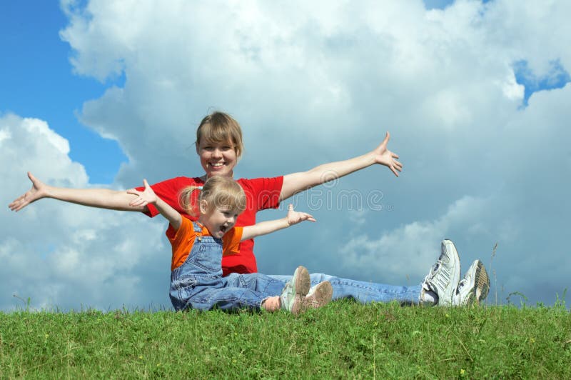 Mother and baby on green grass