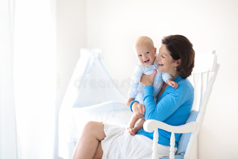 Mother and baby at home. Mom and child in bedroom. royalty free stock image Mother and baby at home. Mom and child in bedroom. royalty free stock image