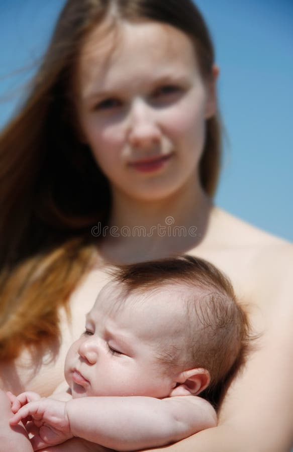 Mother and baby isolated over blue